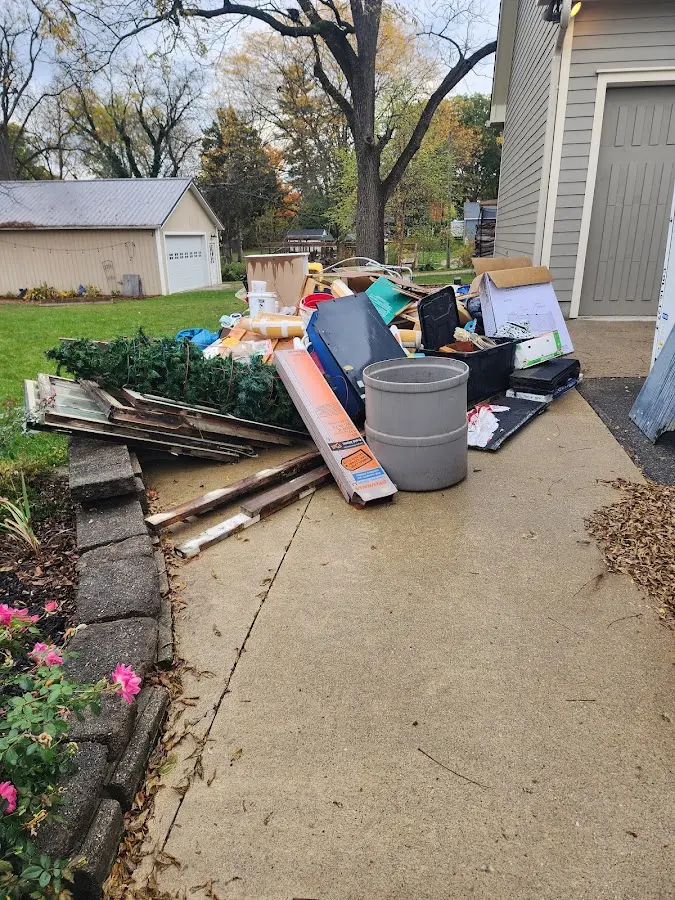 Dumpster being loaded with debris for Roofing Dumpster Rental in Baltimore